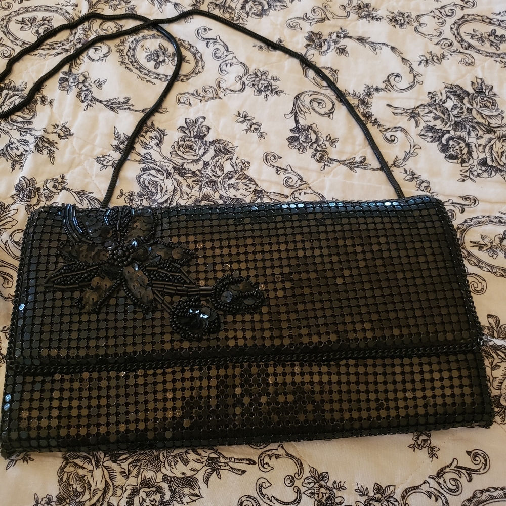 Black sequined evening bag with flower applique